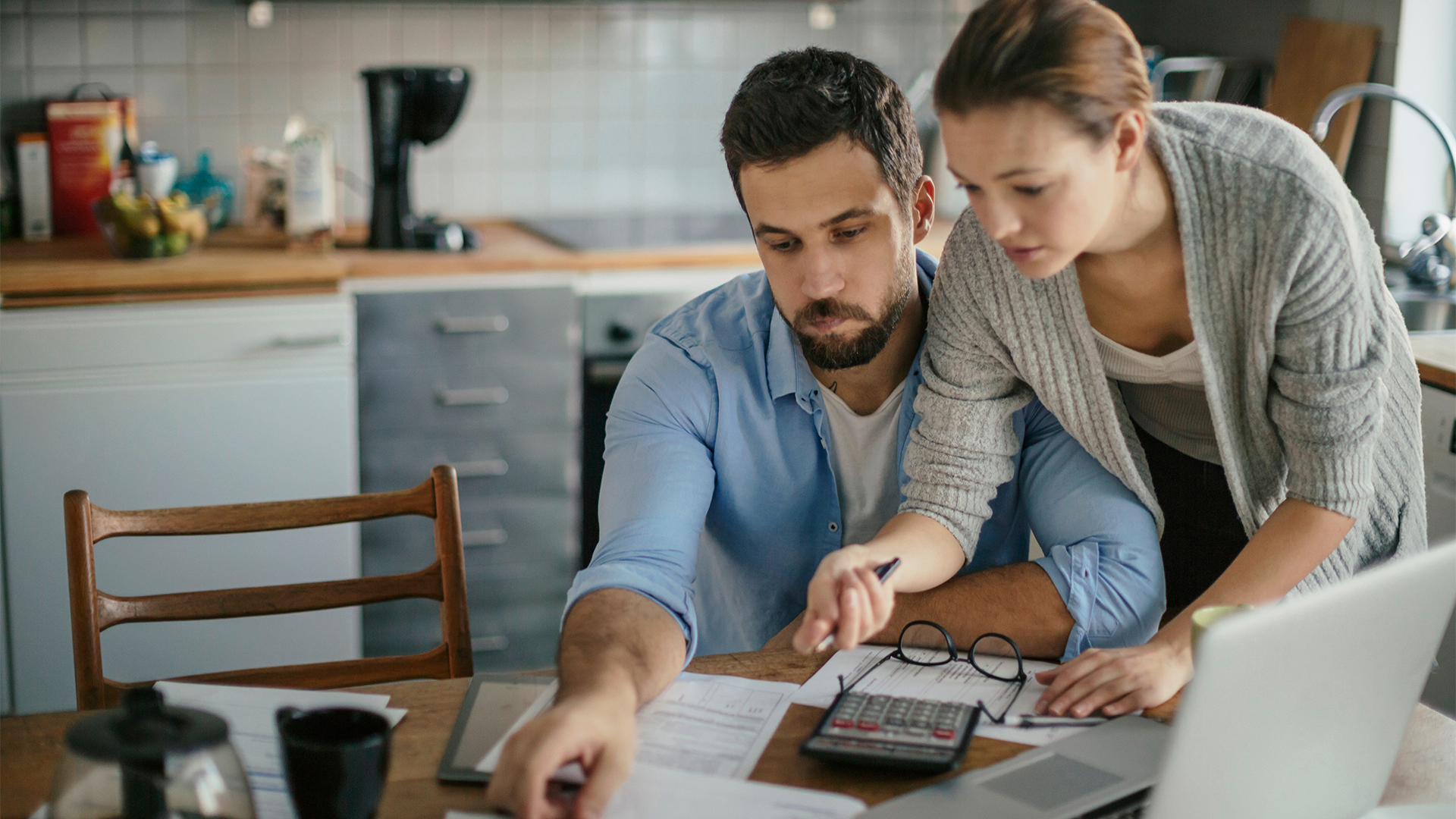 Young couple reading bad financial report