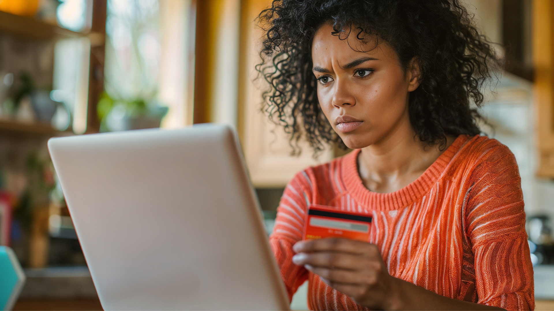 Frustrated woman sitting on laptop