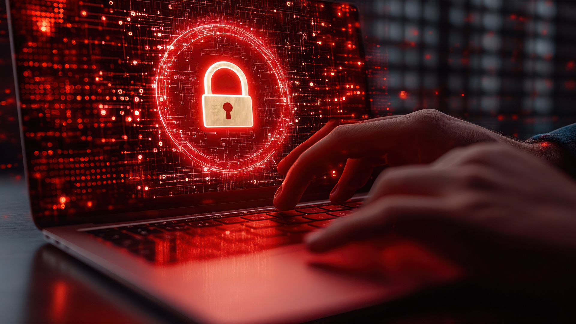 laptop on desk in modern office with red glow and a padlock on the screen