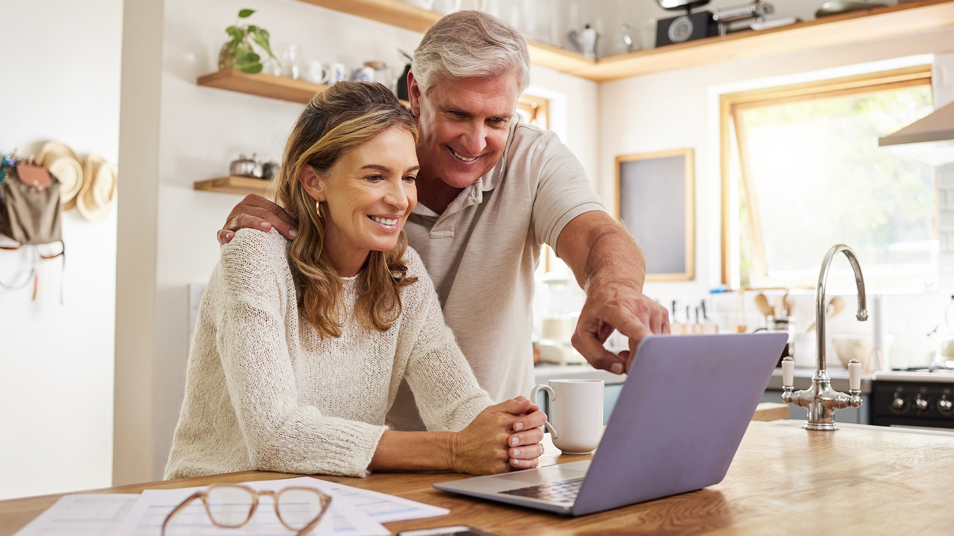 Happy pension couple with laptop and paperwork for retirement planning, online ecommerce website or digital bank application investment.