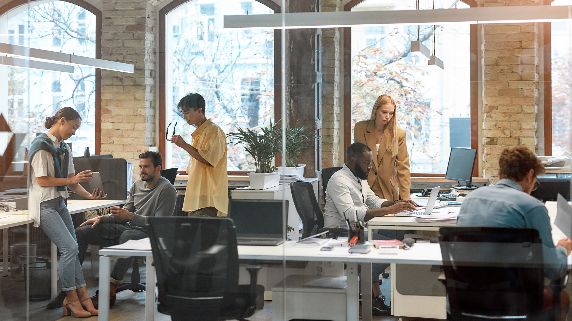 Group of young mixed race business people working together in the creative office.