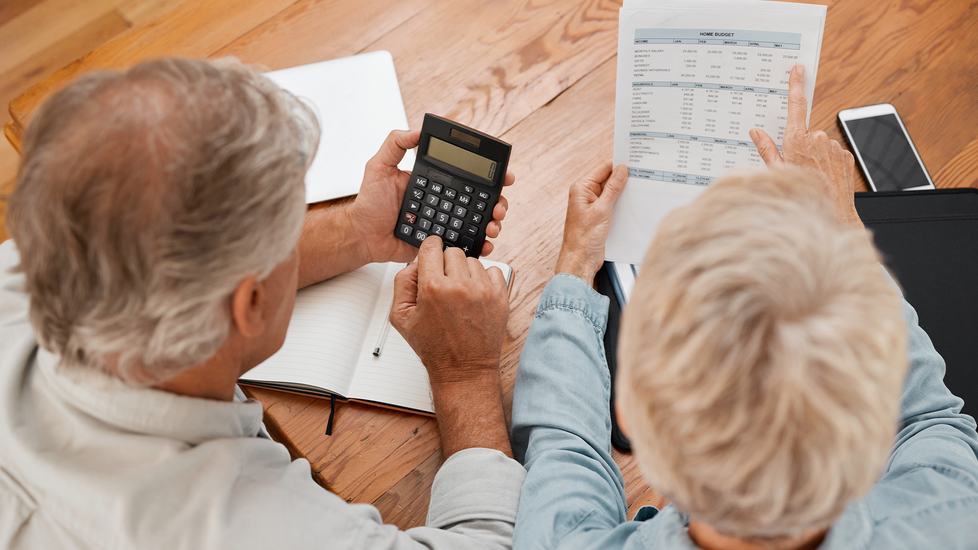 Budget, finance and senior couple with calculator planning financial investments, mortgage and tax papers.