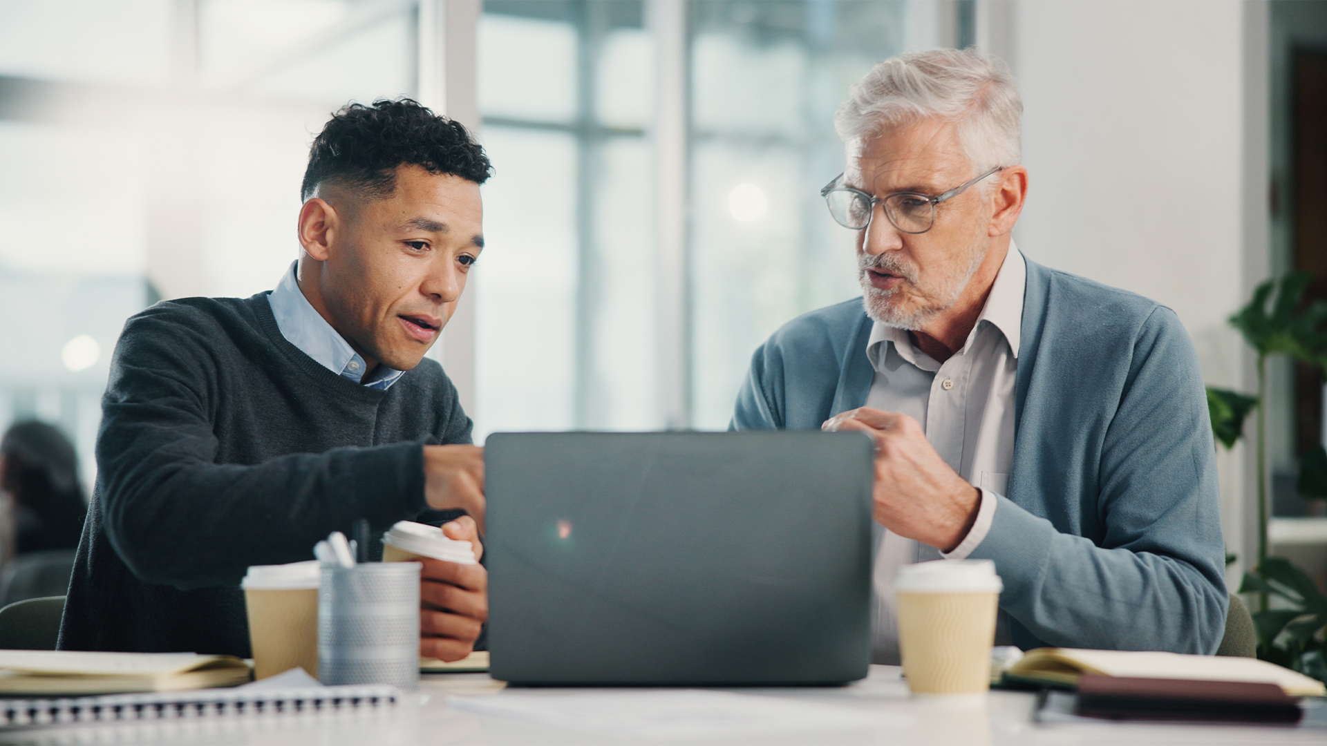 Profit, senior man or financial advisor talking with laptop, retirement fund and pension growth in conversation.